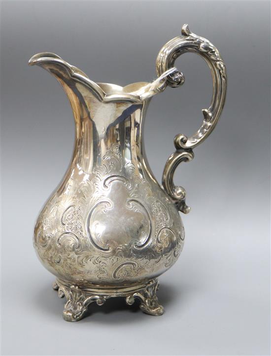 A Victorian engraved silver pear shaped cream jug, William Smily, London, 1856, 7.5 oz.